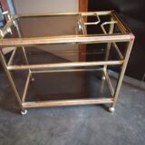 Brass and smoked glass bar trolley with casters