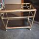 Brass and smoked glass bar trolley with casters