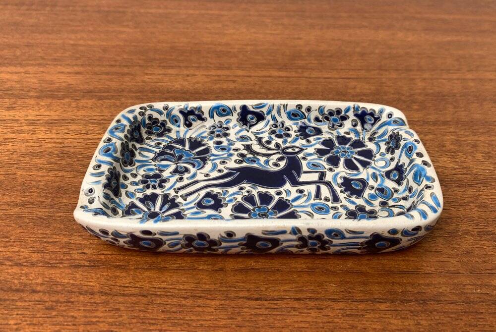 Vintage handmade blue ceramic ashtray with deer and flower ornament from Rodos Ceramics.
