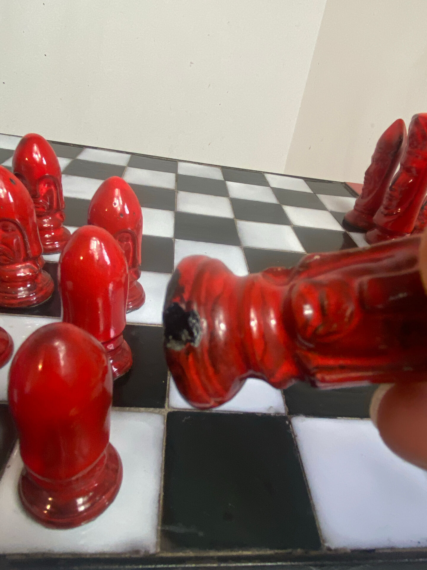 Chess set with ceramic board and pieces.