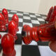 Chess set with ceramic board and pieces.