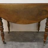 Walnut shuttered table, on casters