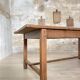 Solid wood workshop table with straight legs.