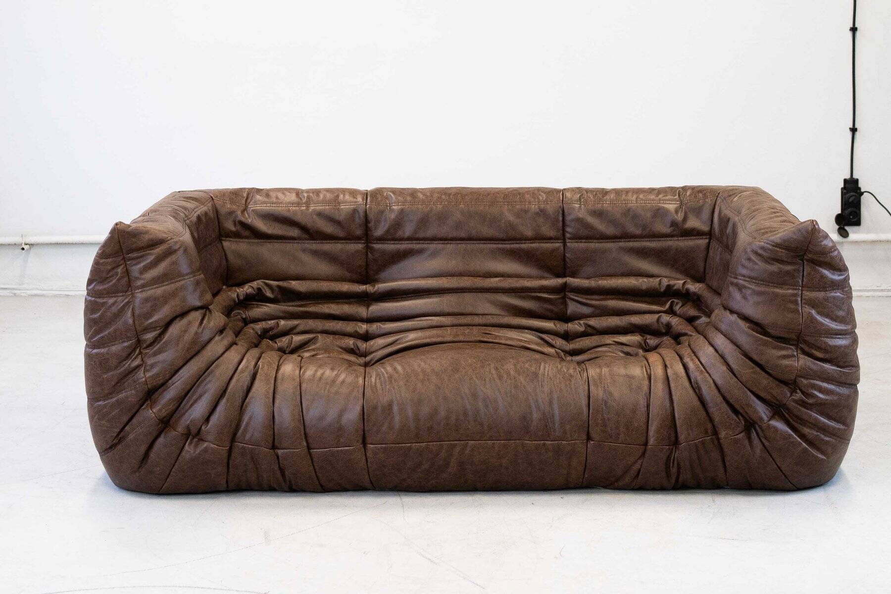 Vintage two-seater Togo sofa with arms in brown leather by Michel Ducaroy for Ligne Roset, 1970s