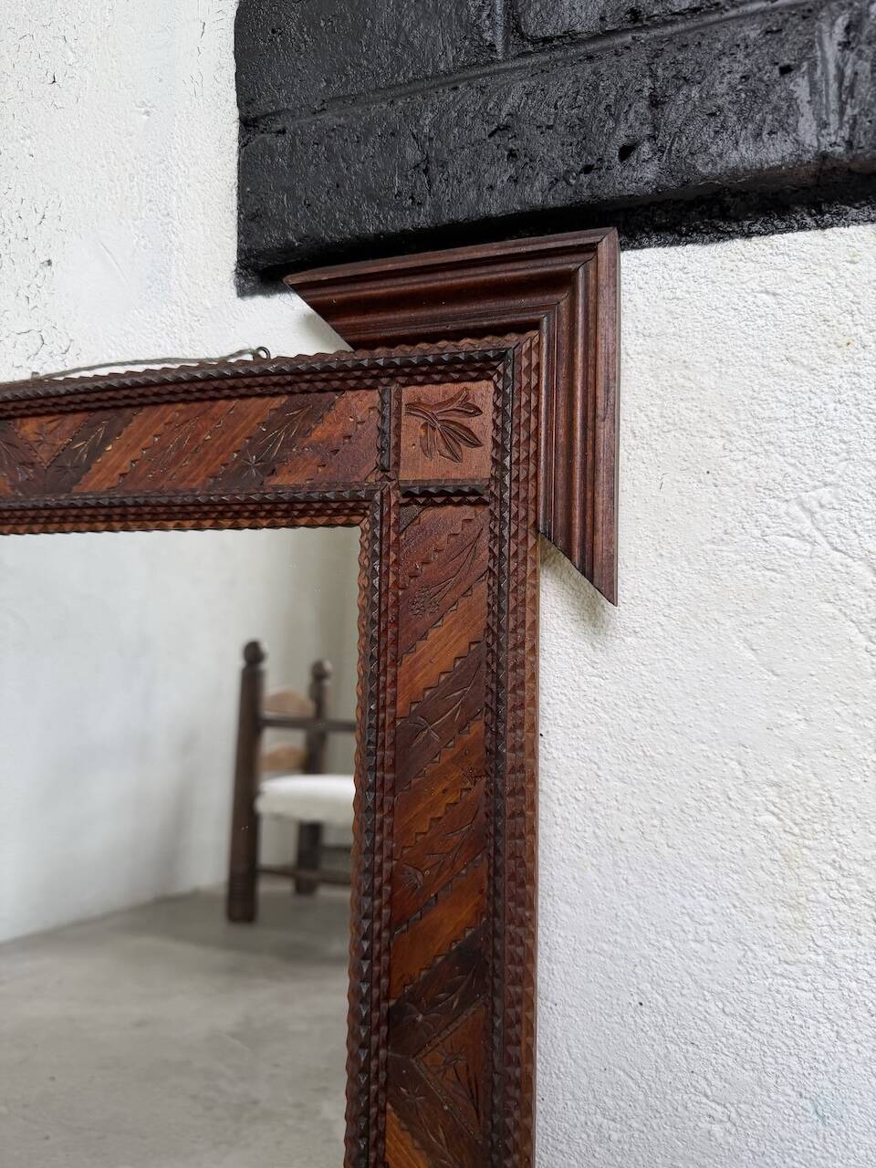 Pair of wooden mirrors in tramp art style