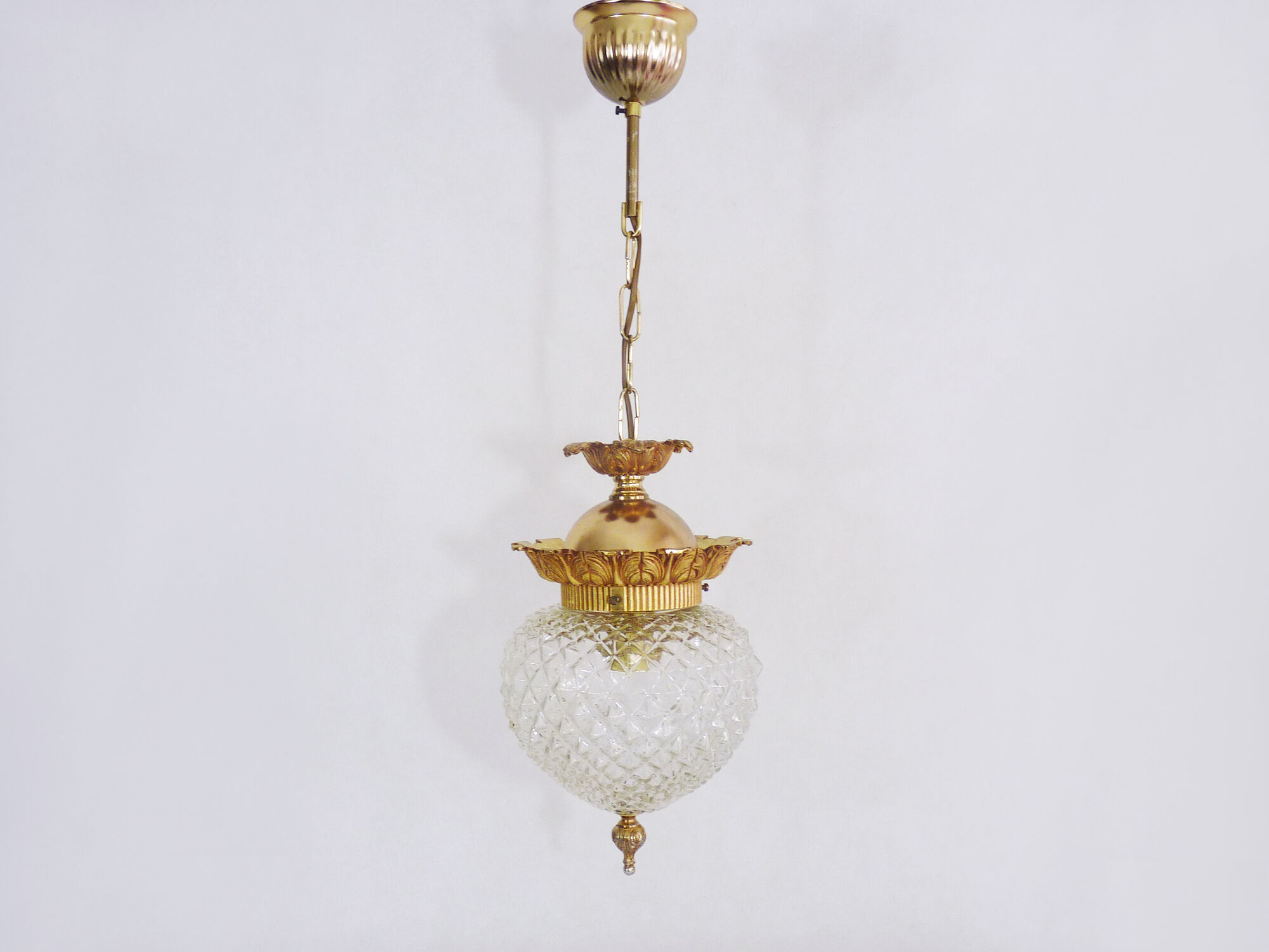 Brass and diamond-tipped chiseled glass globe hanging lamp
