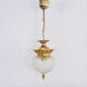 Brass and diamond-tipped chiseled glass globe hanging lamp