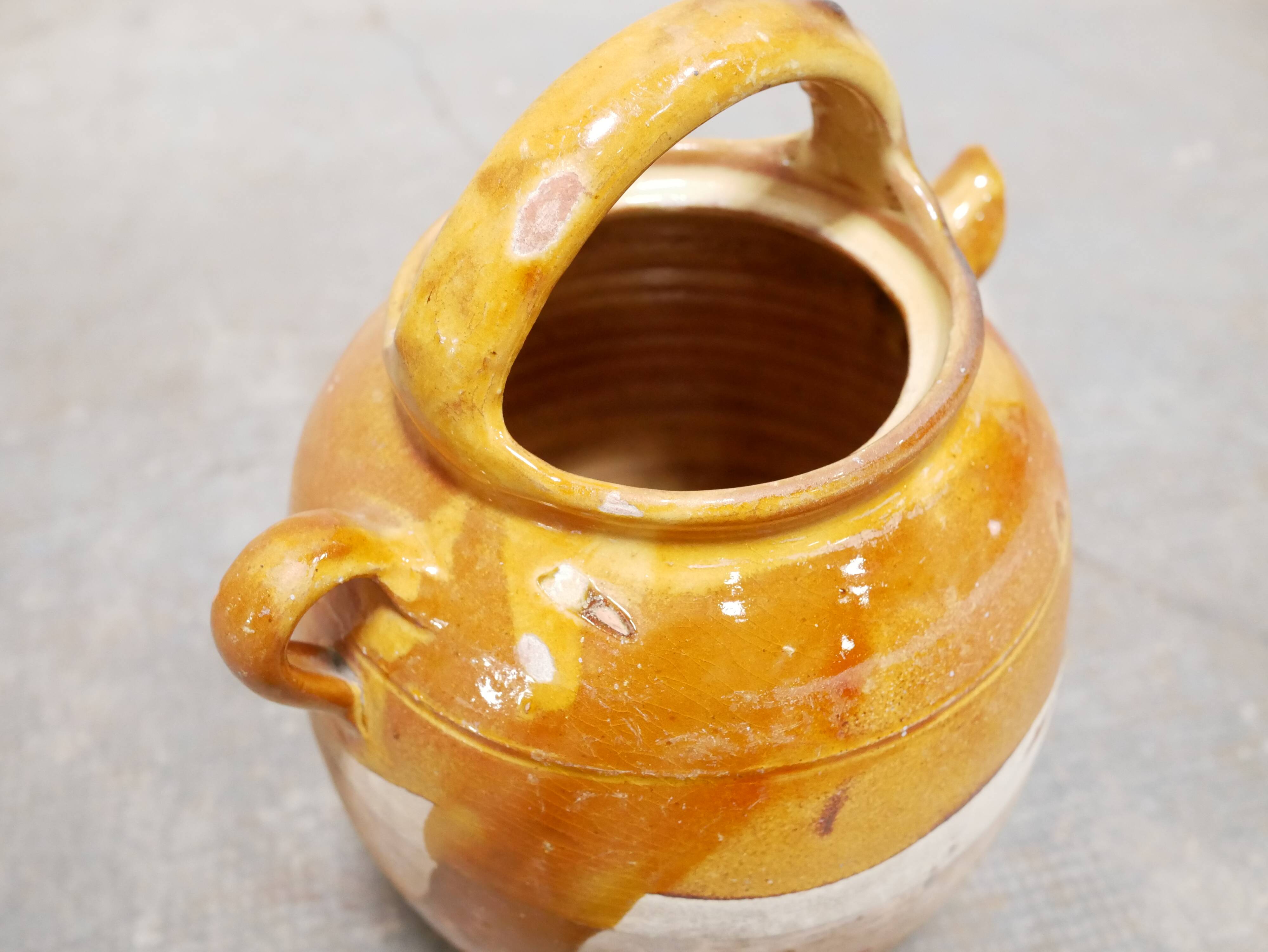Old gargoulette pot in glazed terracotta