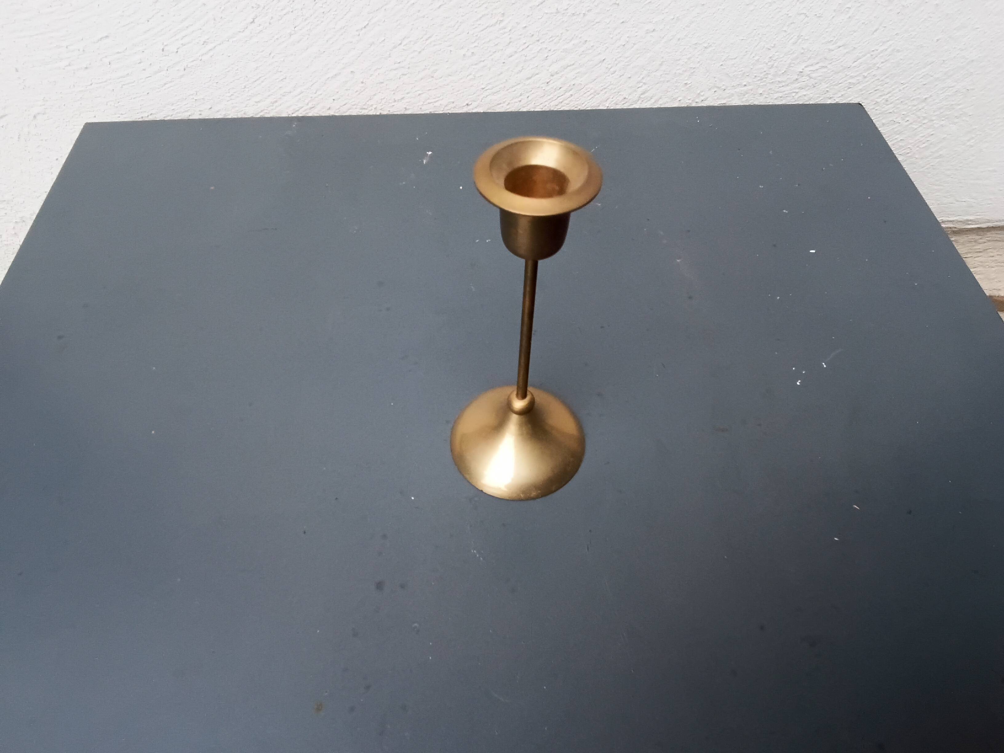 A brass candle holder