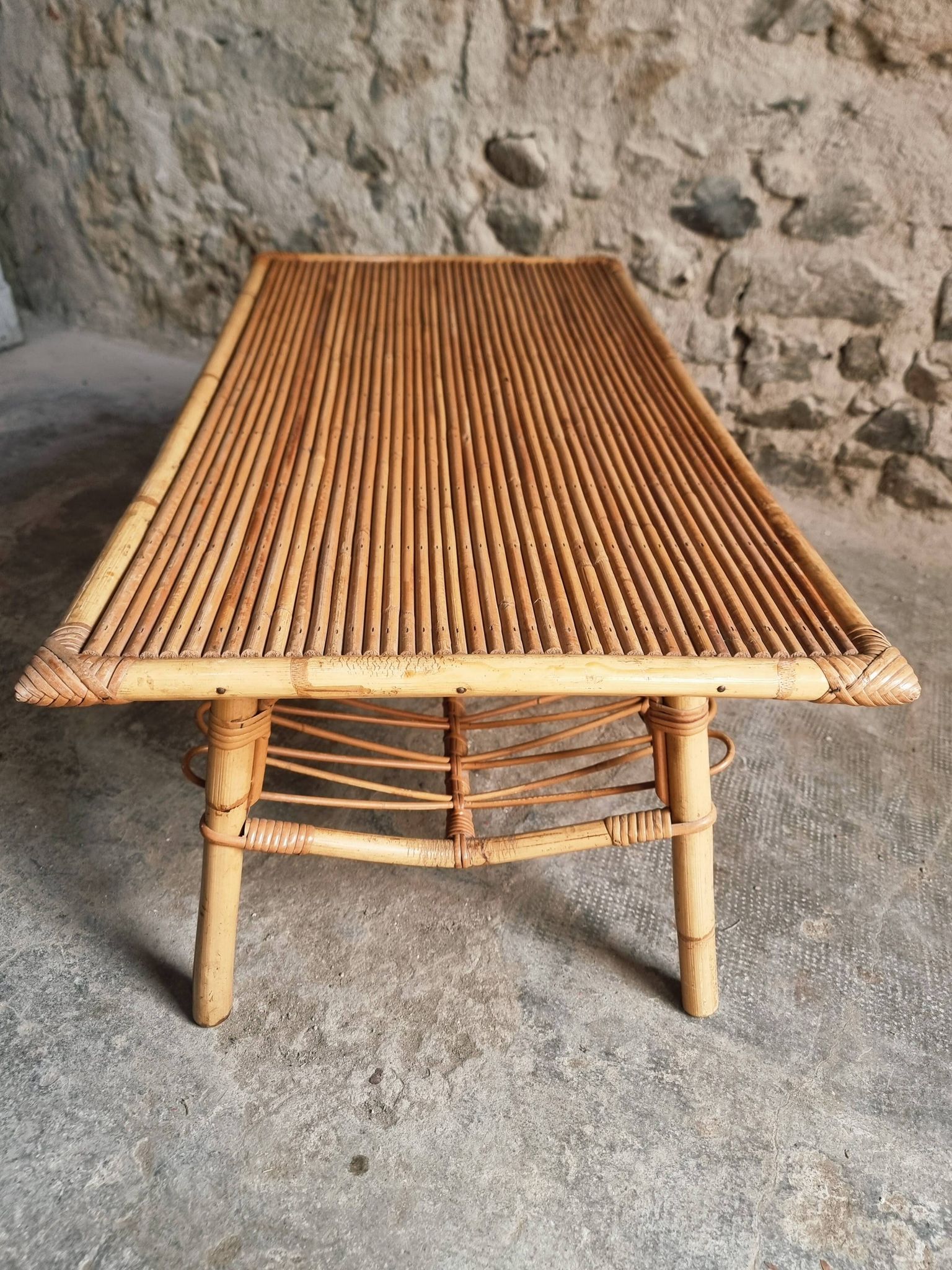 Vintage bamboo and rattan coffee table with magazine rack, French, circa 1960–1970.