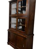 Vintage wooden display cabinet with sliding doors.