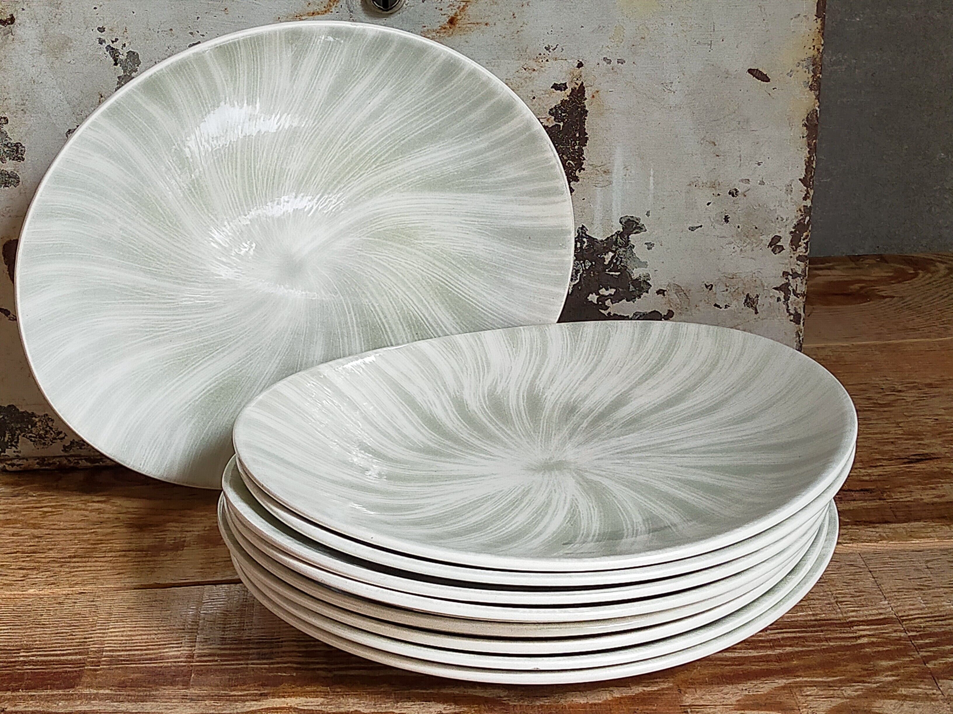 Nine earthenware plates from Salins-les-Bains vintage