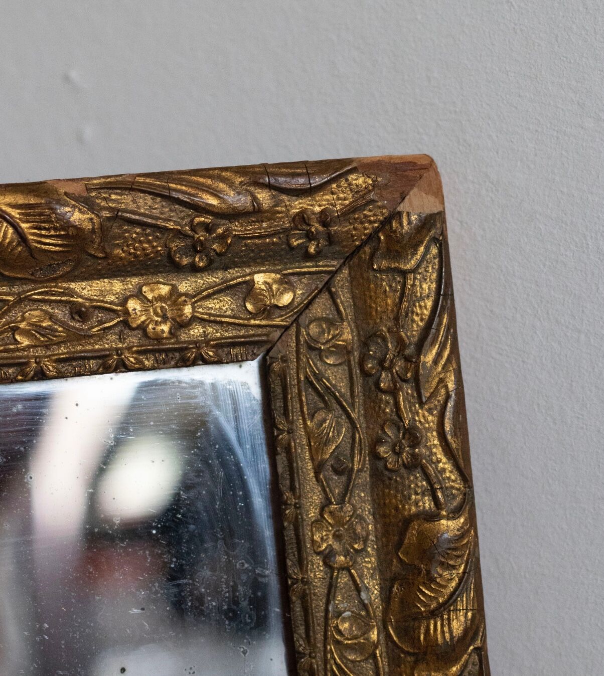 Antique mirror in gilded wood