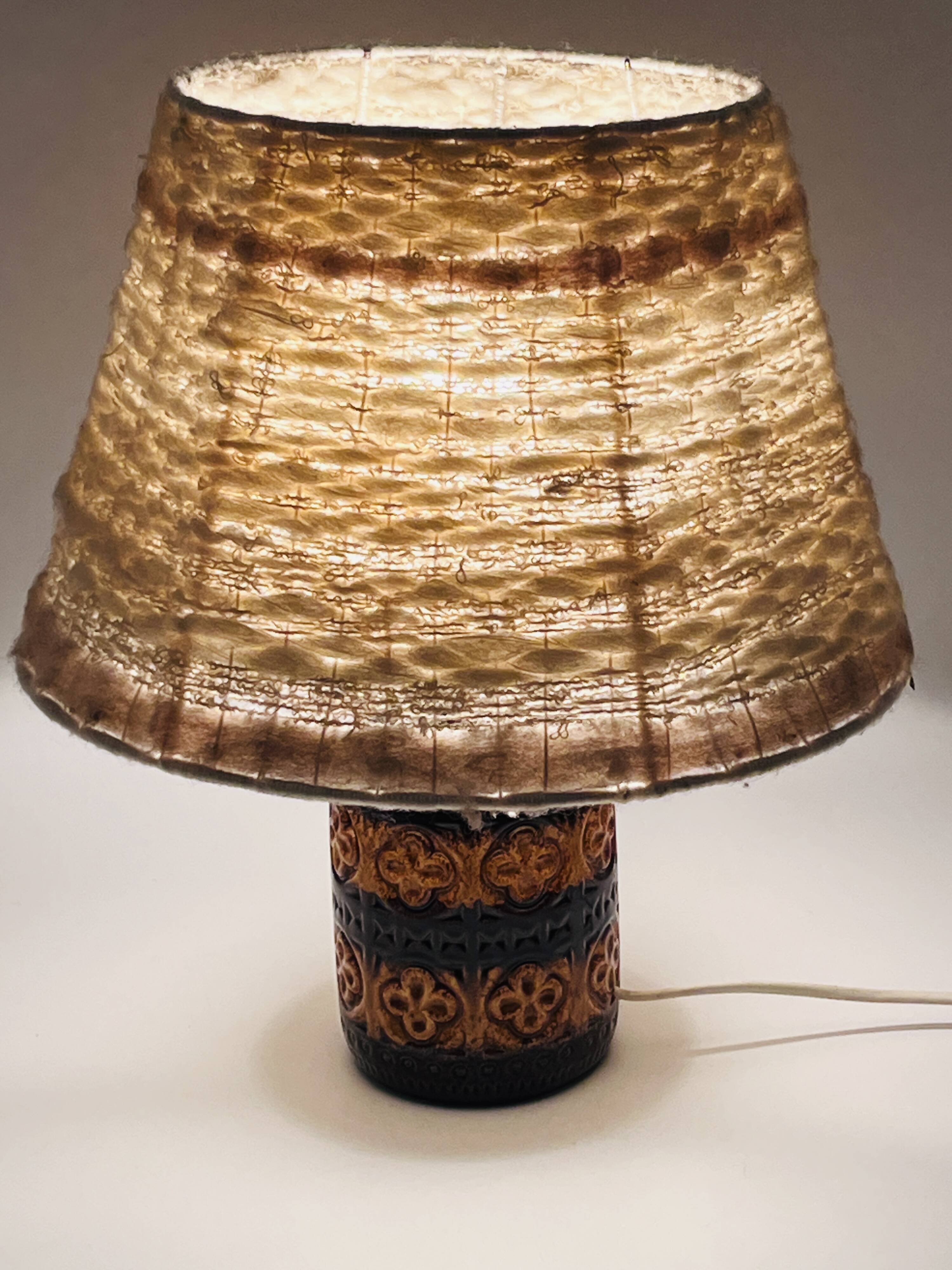 Vintage ceramic lamp with relief and wool shade.