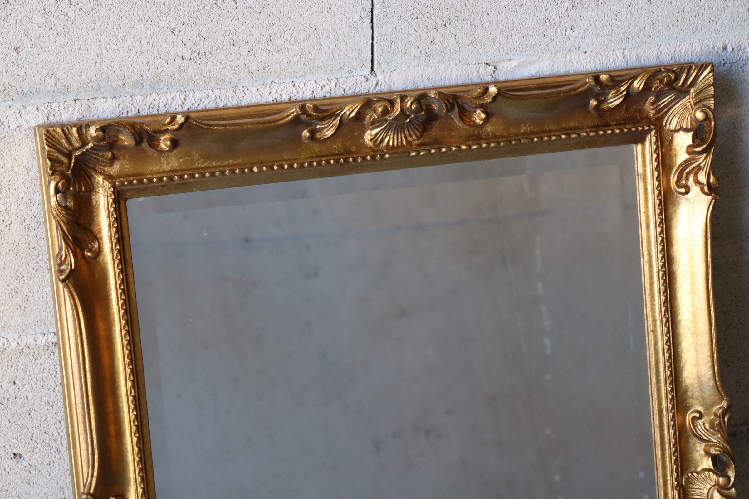Bevelled gilded wood mirror