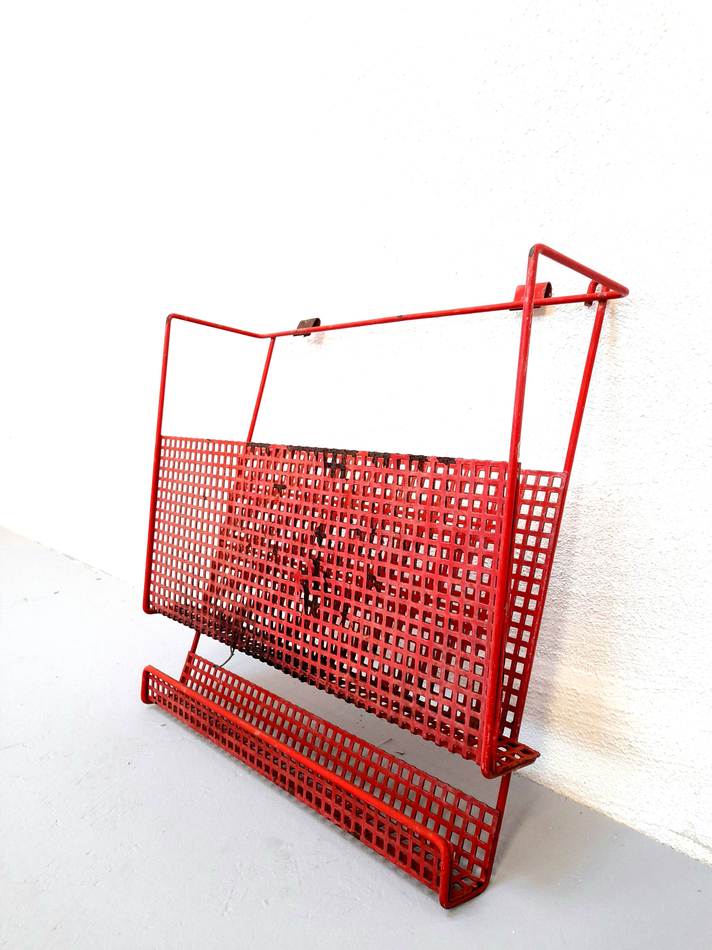 Vintage magazine rack in red lacquered perforated metal from the 70s