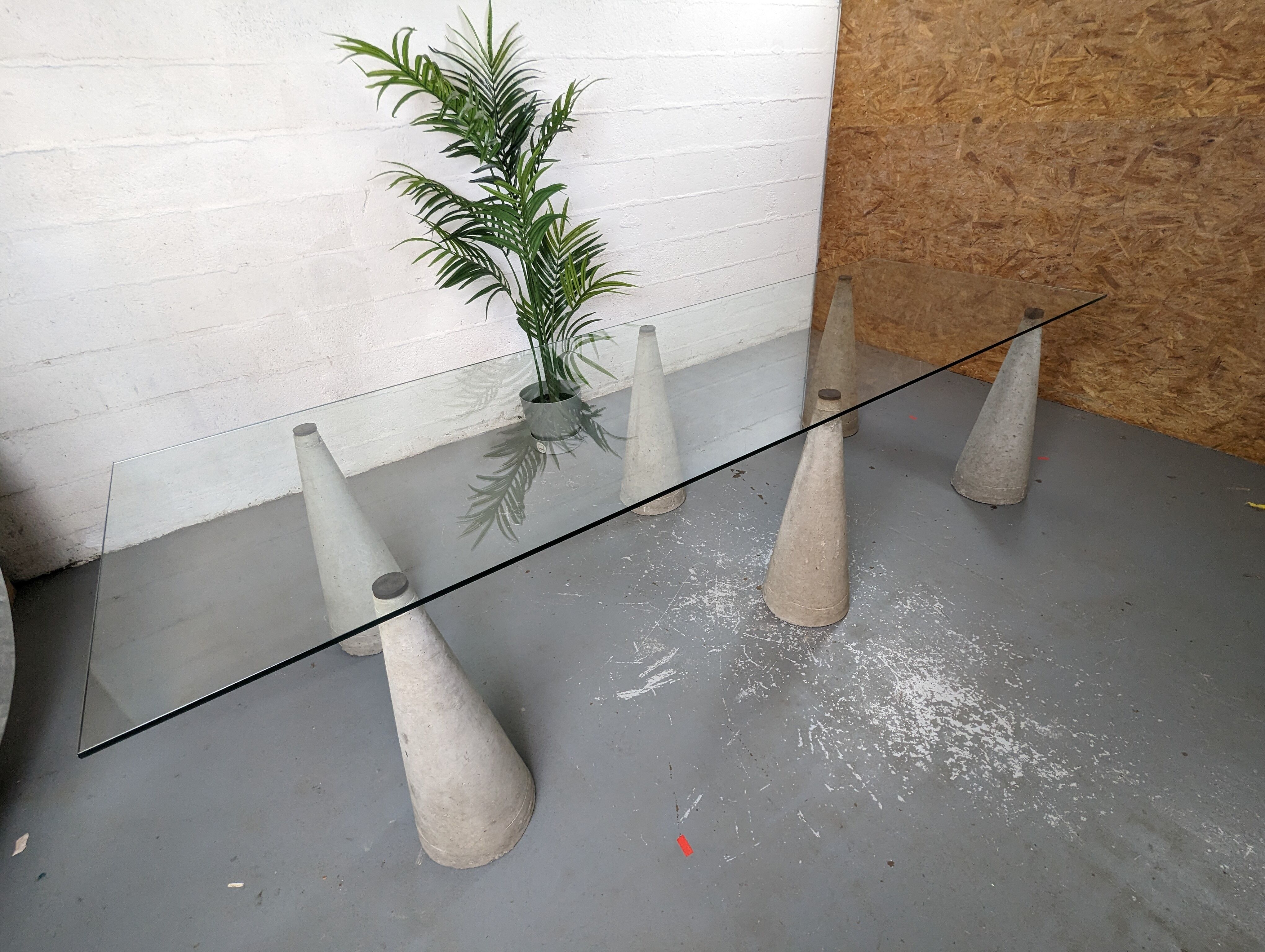 Glass table with cement legs