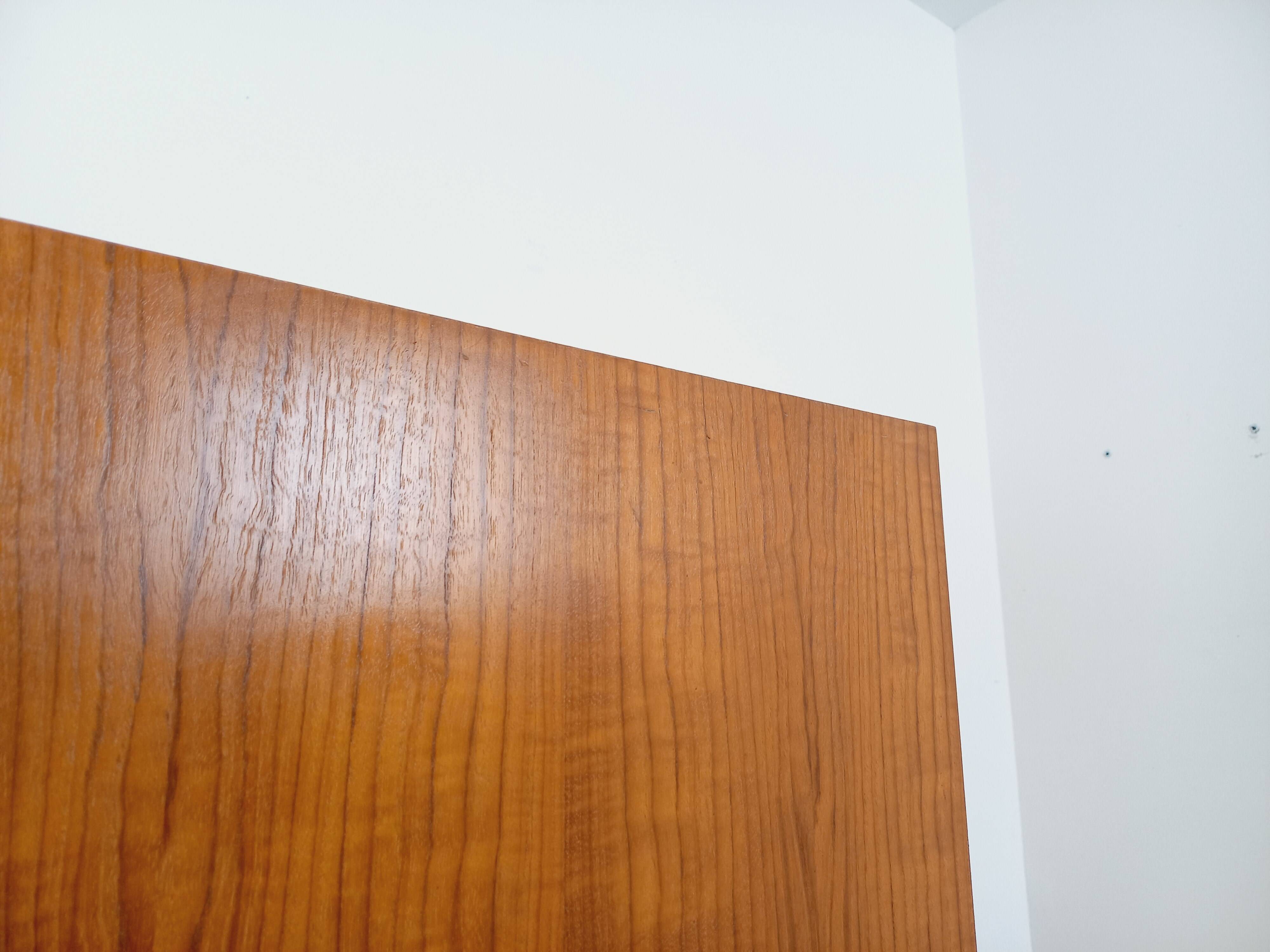Vintage modernist wardrobe in teak and metal from the 1960s.
