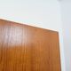 Vintage modernist wardrobe in teak and metal from the 1960s.