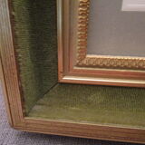 Old wooden and gilded stucco frame