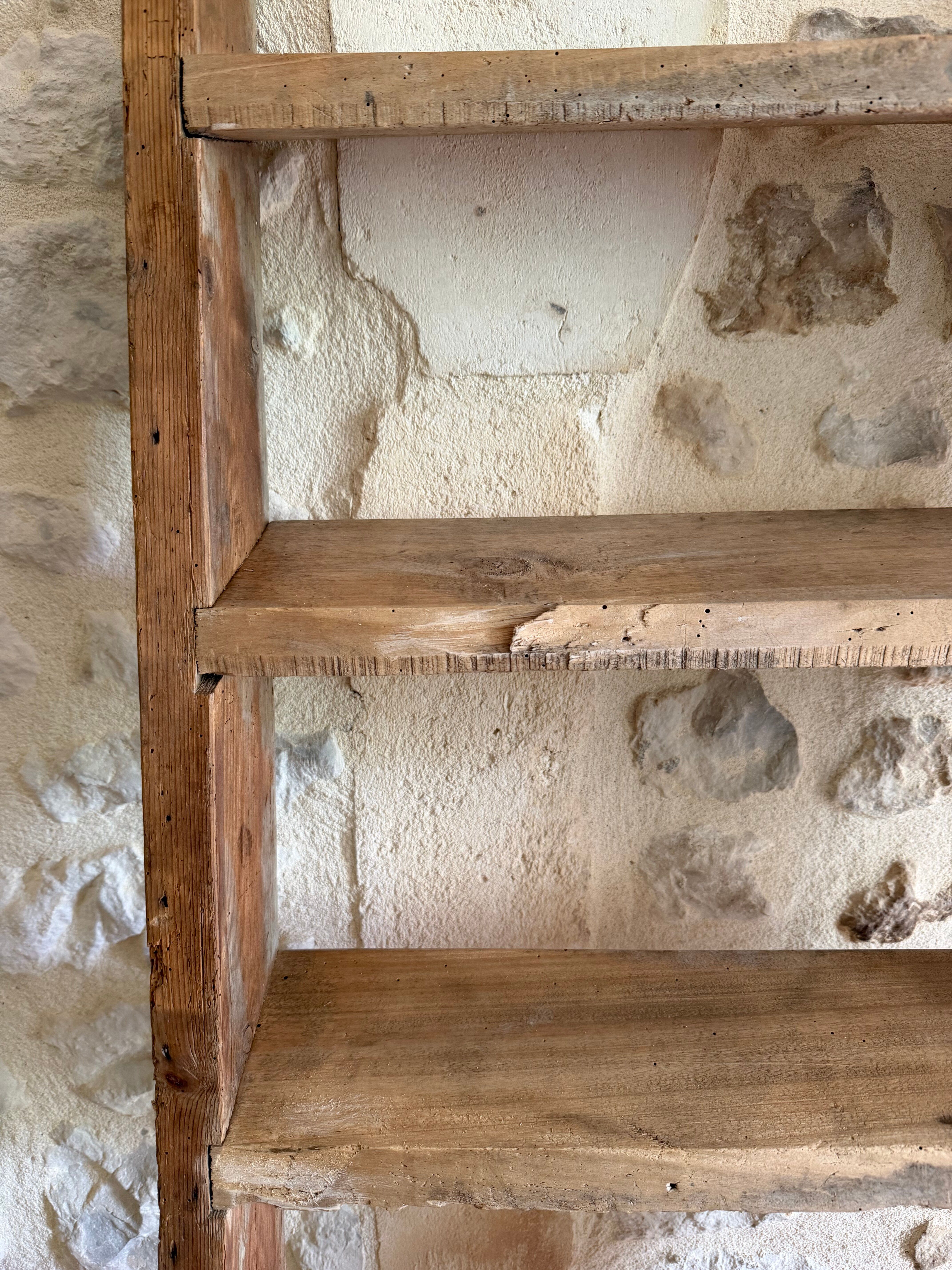 Decorative wooden ladder or towel rack.