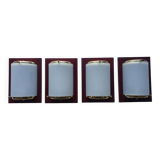 Four vintage gold wall lights with opaline globes on wooden support