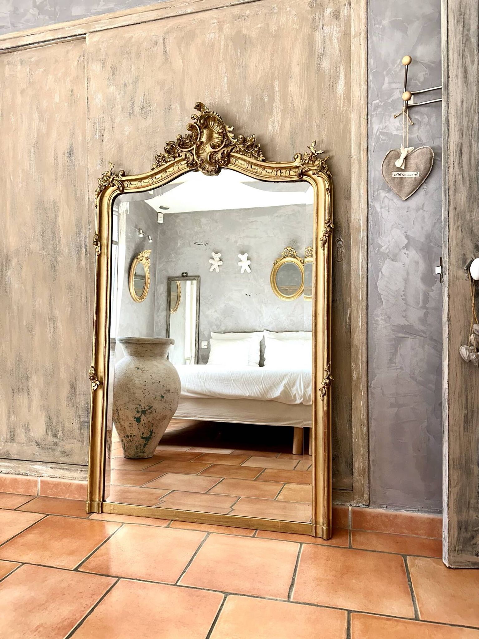 Antique gilded Louis XV pediment mirror
