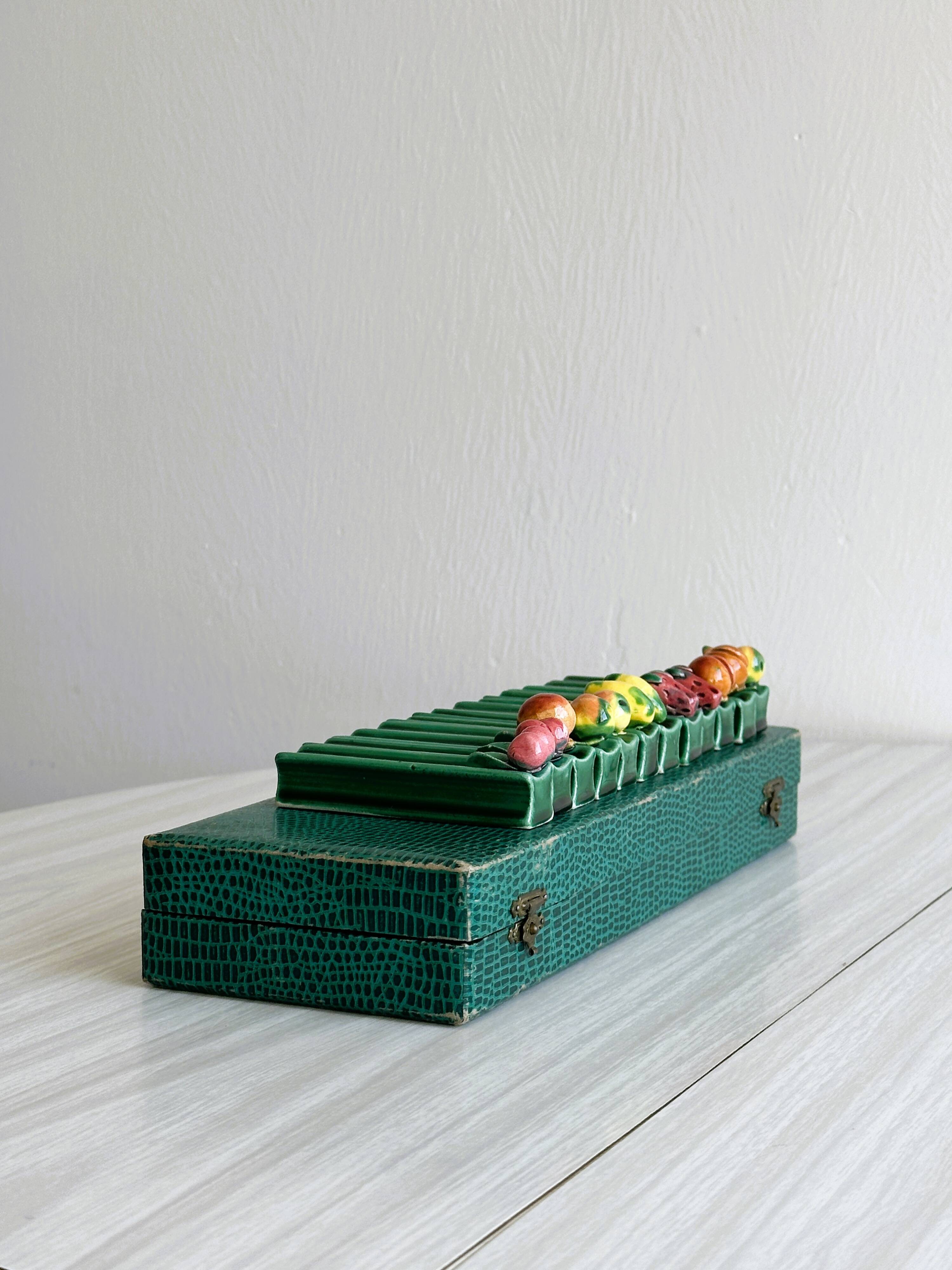 12 ceramic fruit knife holders.