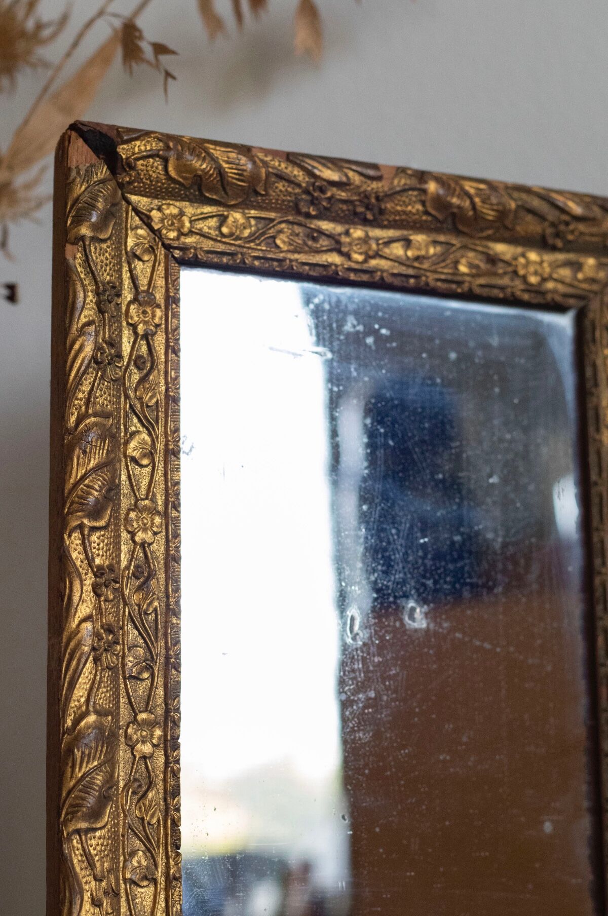 Antique mirror in gilded wood