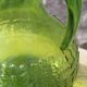 Antique vintage pitcher in green molded glass with floral relief - retro decoration