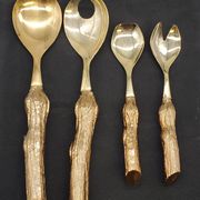 Lot of serving spoons, dessert spoon and fork in gold metal.