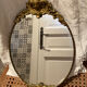 Antique bronze oval mirror