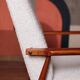 Vintage salon chair in white boucle with a 1950s design.