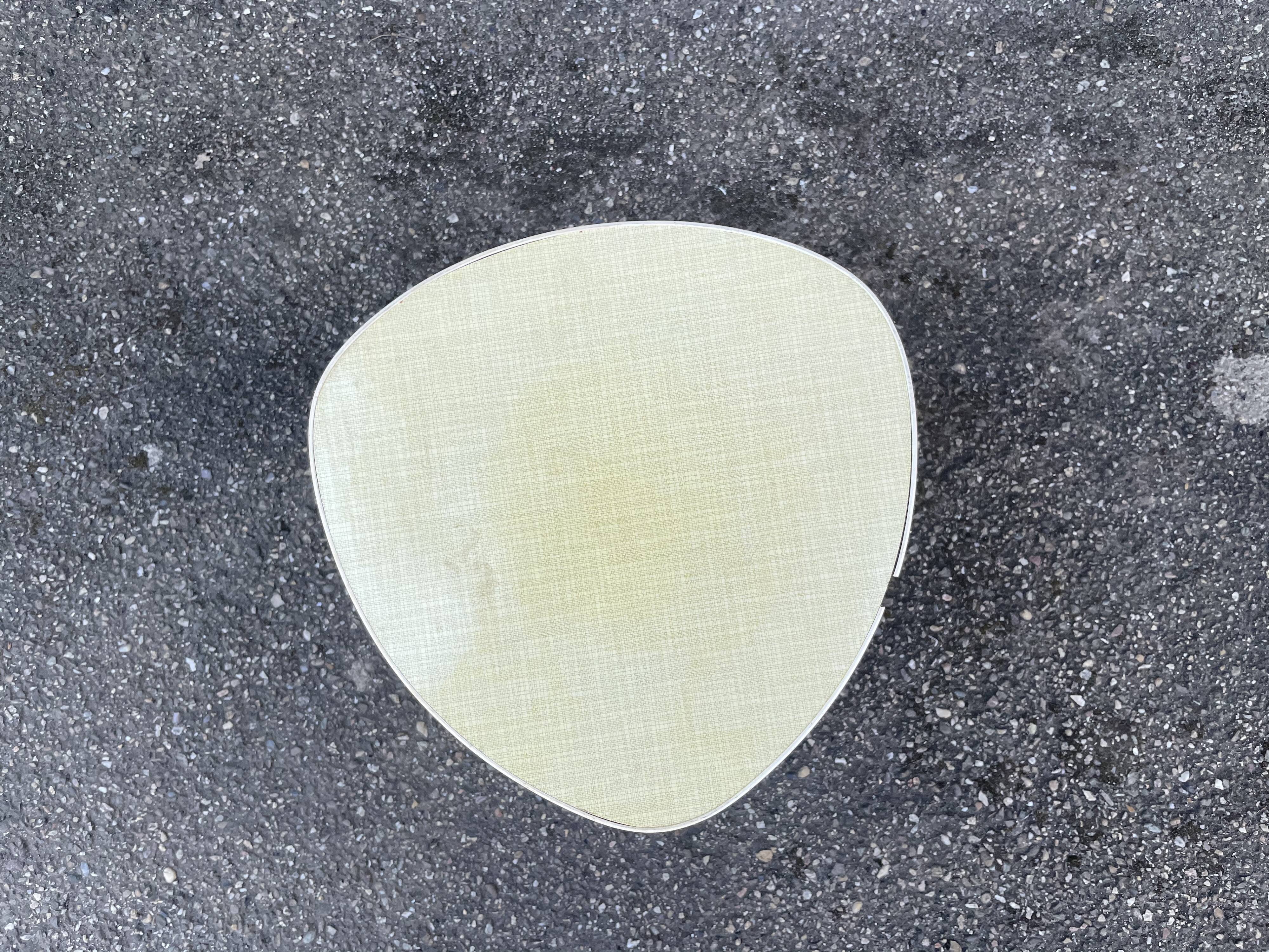 Small triangular paneling small yellow coffee table tripode door midcentury plant 1950 old