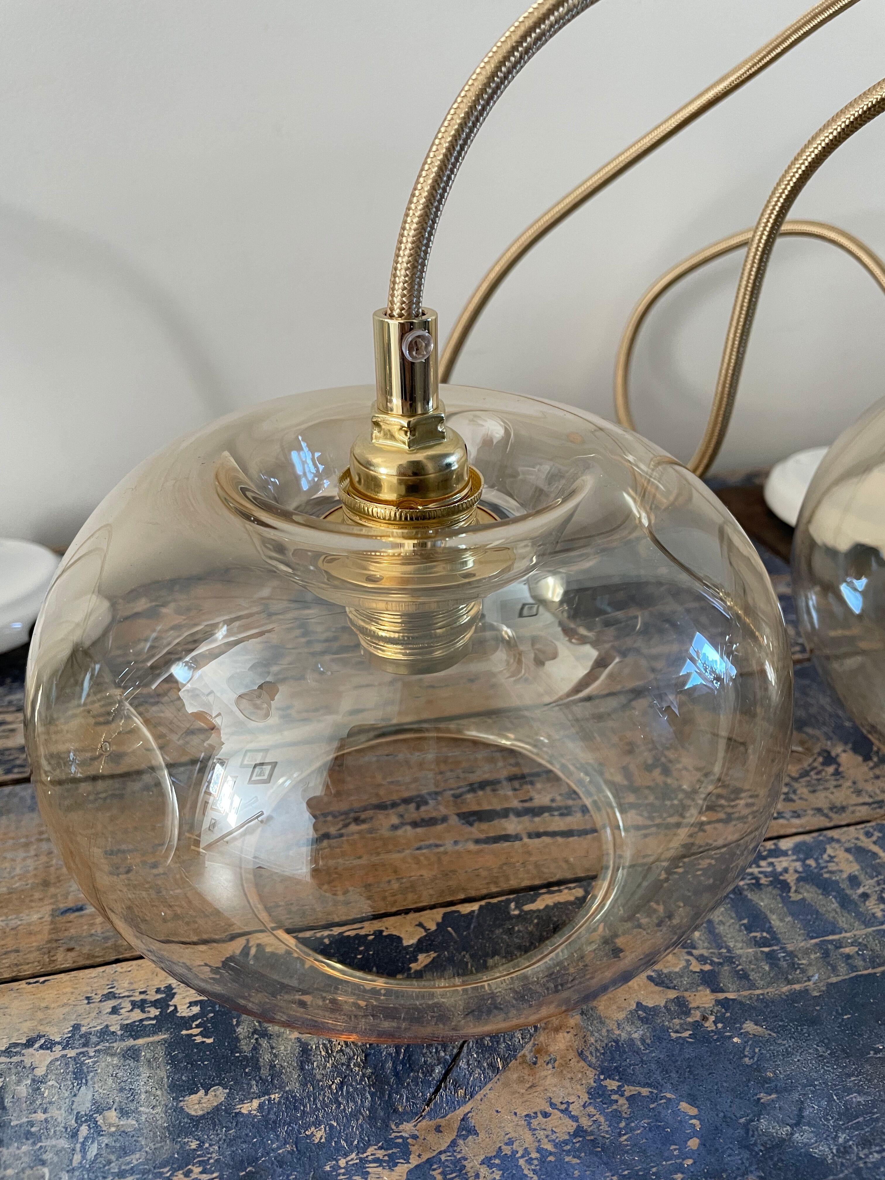 Set of three glass hanging lamps