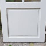 Old wooden door with small squares
