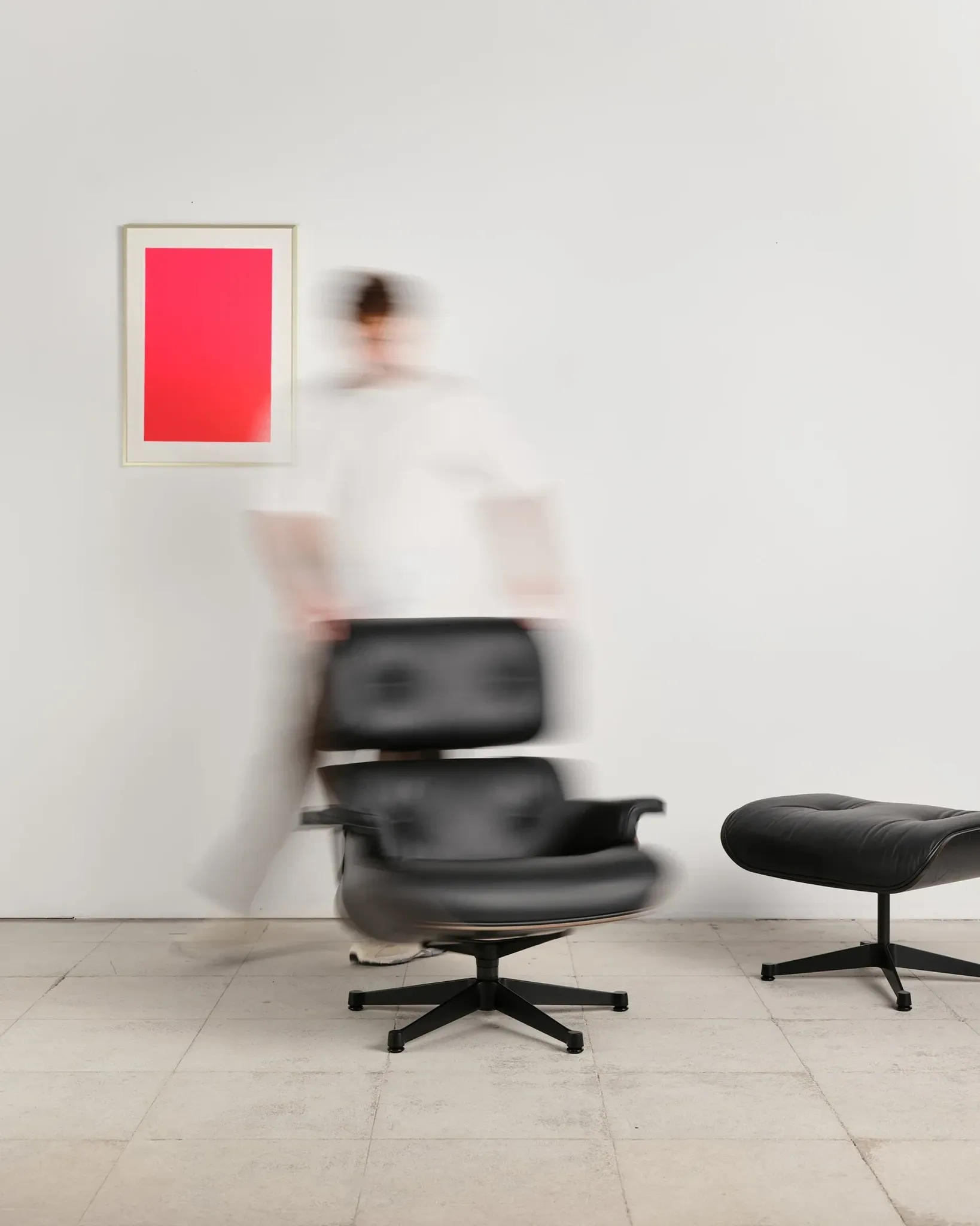 Lounge Chair and ottoman in black leather by Charles & Ray Eames, Vitra