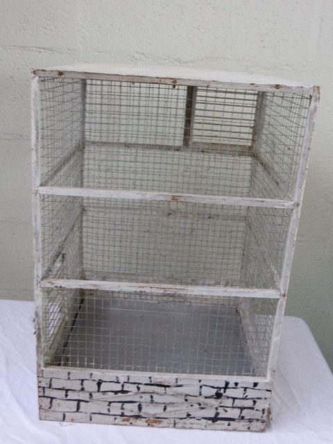 Vintage bird cage, made of wood and chicken wire metal square mesh