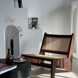 Reclined armchair in canned teak in natural wood
