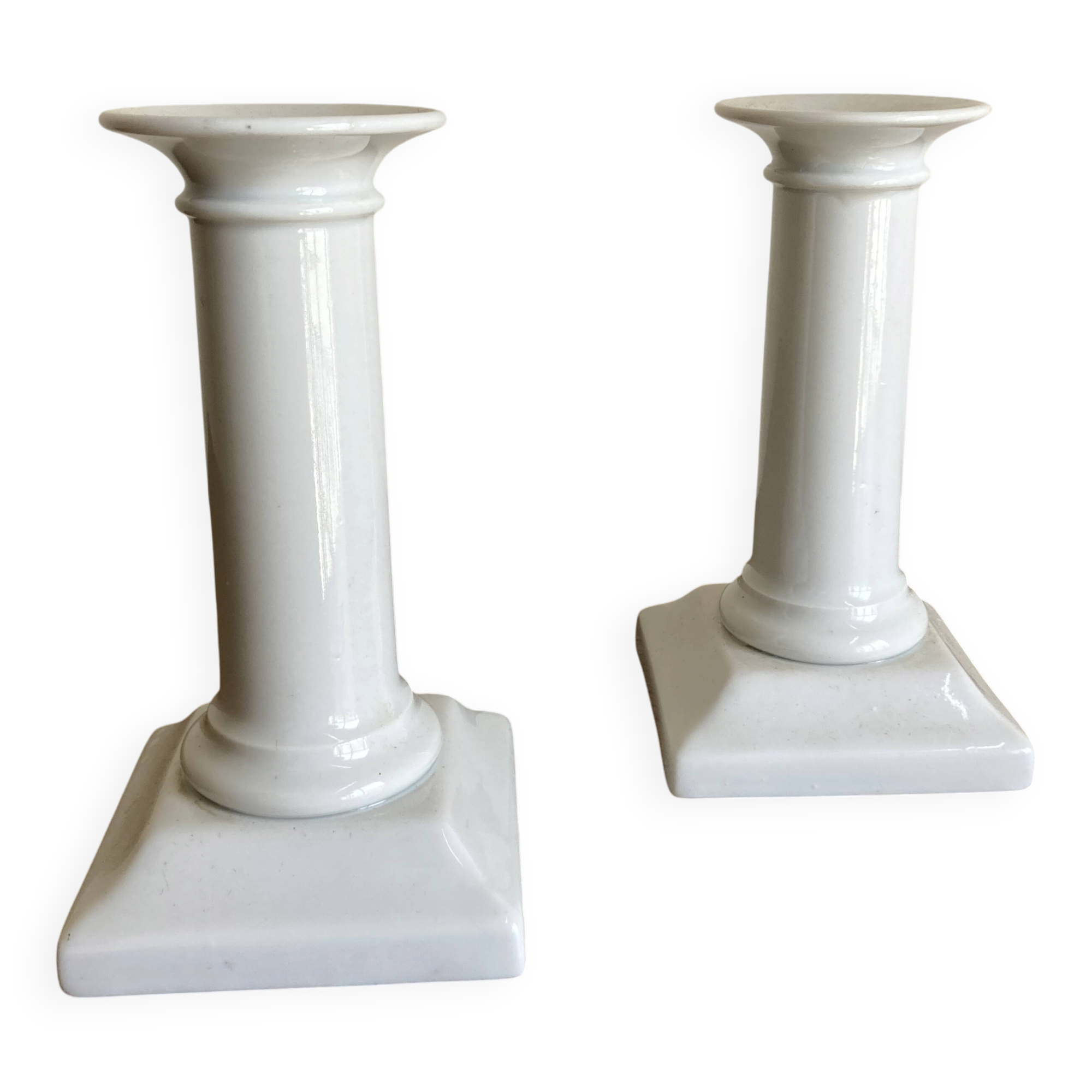 Pair of neo-classical Empire candlesticks from the late 19th century in white porcelain.