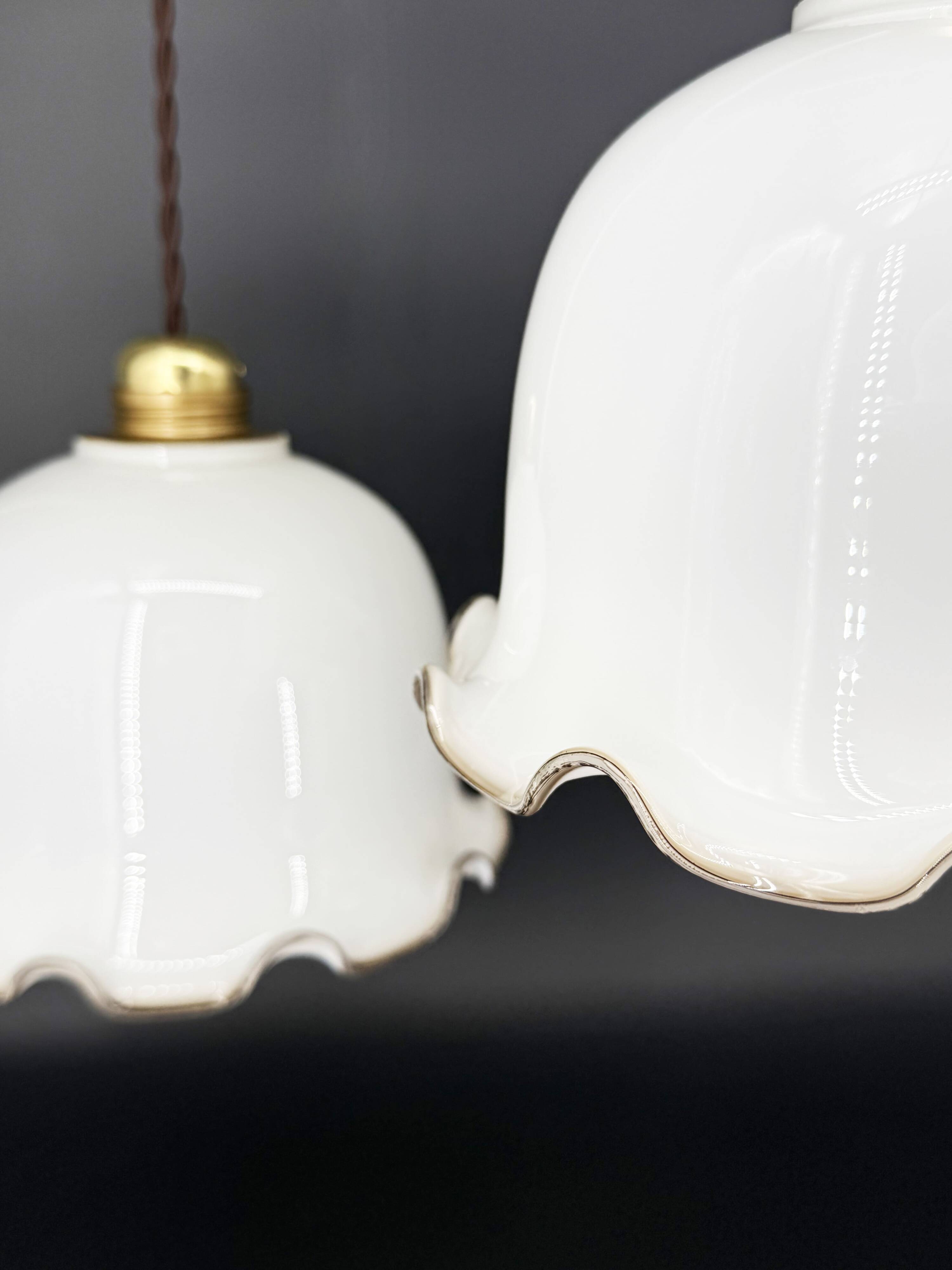 Set of 3 vintage bell-shaped pendants in white opaline with brown trim.