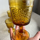 Six stemmed glasses in amber-colored molded glass
