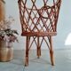 Old tripod rattan plant holder