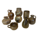 Eight brown ceramic pitcher vases