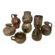 Eight brown ceramic pitcher vases