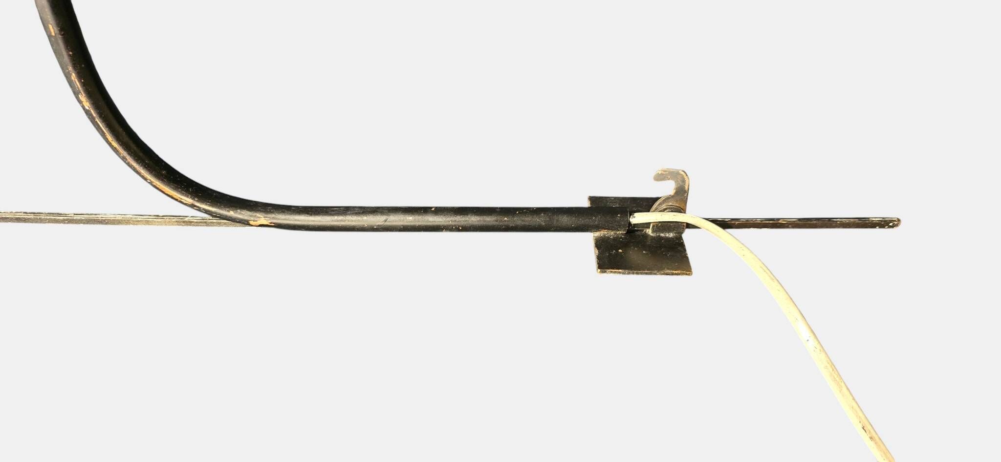 Minimalist metal wall light in the style of Jean Prouvé, circa 1950.