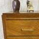 Commode aux pieds compas