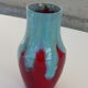 An emailed ceramic vase in turquoise and red, design and vintage