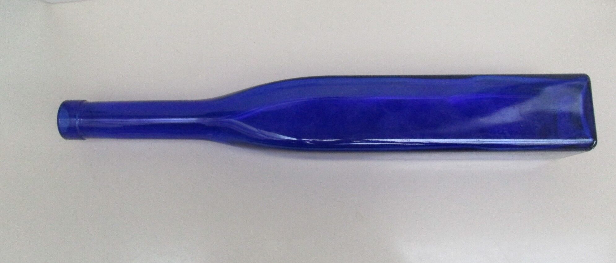 Blue glass bottle, square