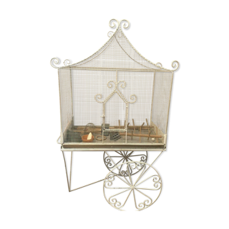 Cage has birds on trolley wheeled wrought iron volière 20th century